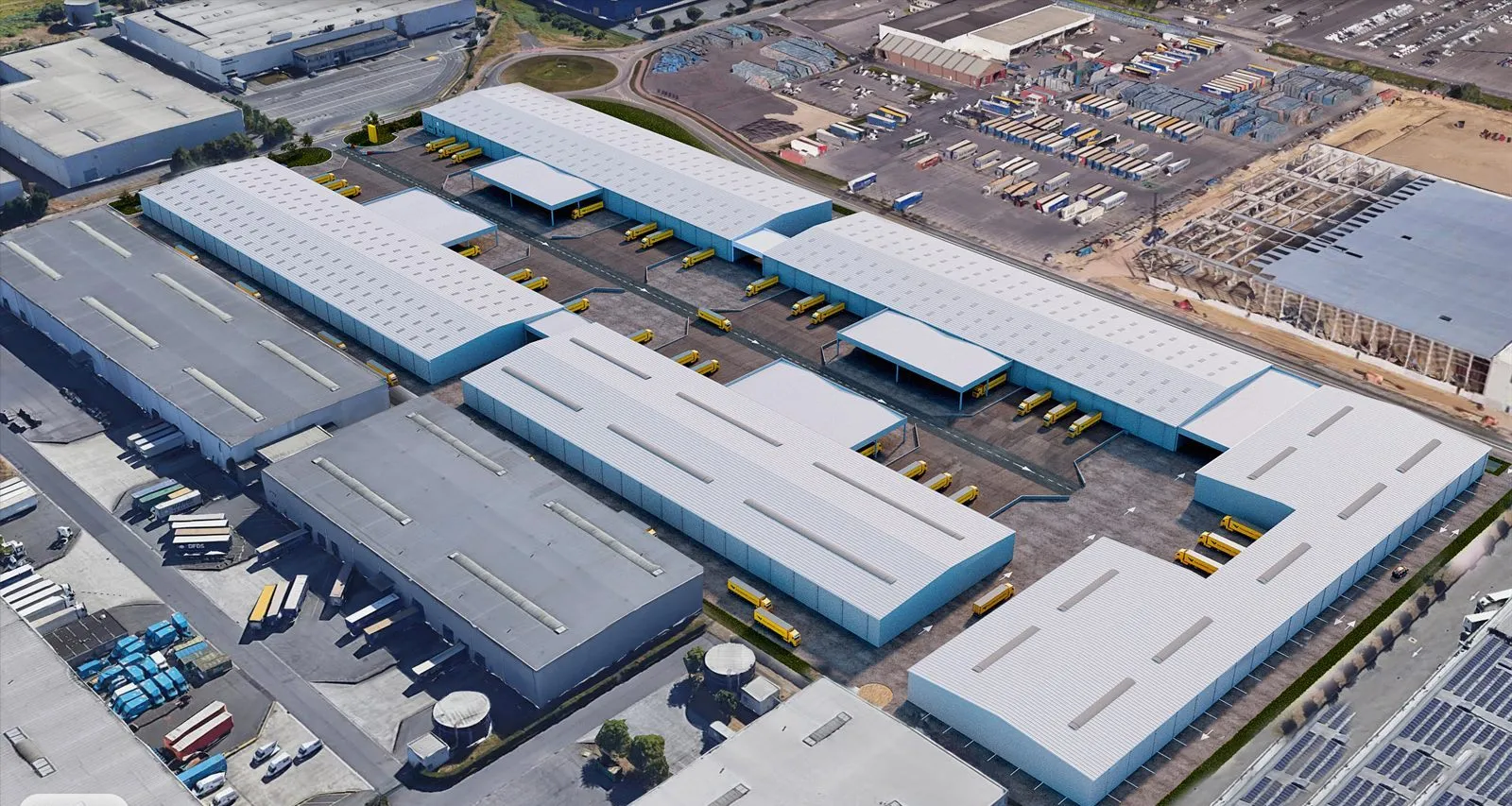 Aerial angle across the truck court, dock banks and trailer standing