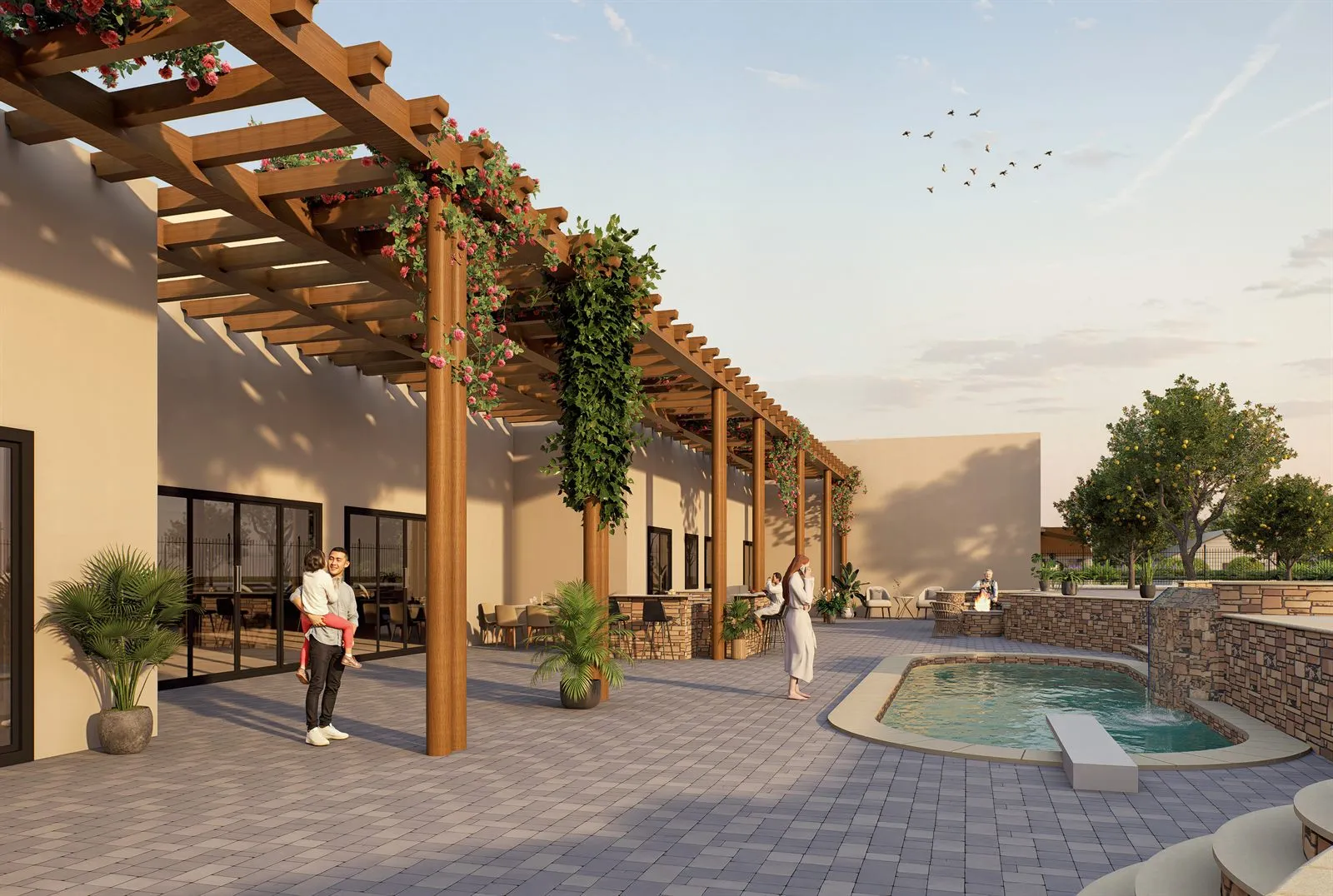 Revised backyard with pergola, bougainvillea, paver terrace and raised spa at dusk