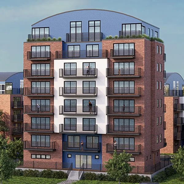 One of the two middle towers: red clinker, a white bay, steel balconies and a dove-blue barrel-roofed penthouse